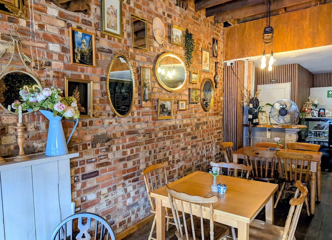 The warm, plant-filled interior of Peony Café