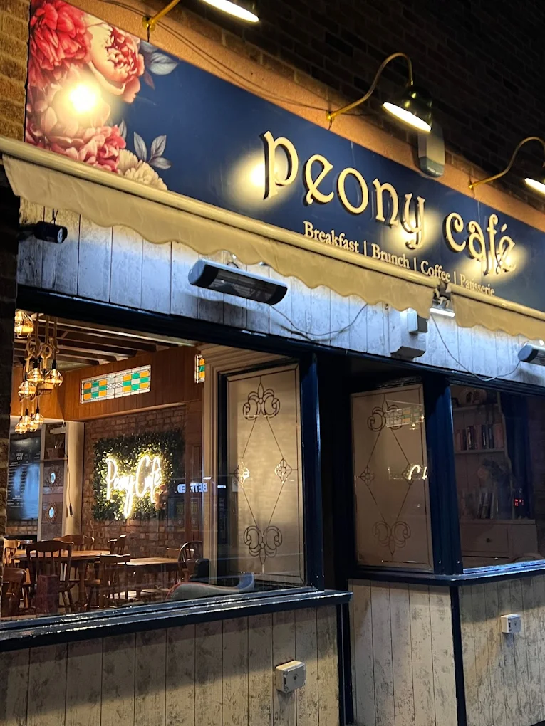 The Peony Café storefront on Leicester Road